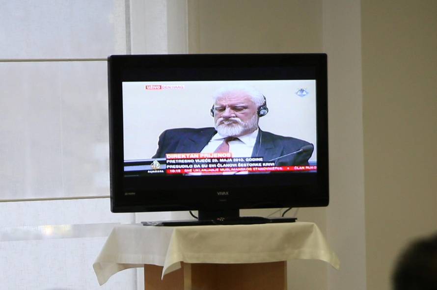 Bosnian Croat senior wartime official Praljak is seen during TV broadcast of the appeal trial in Mostar