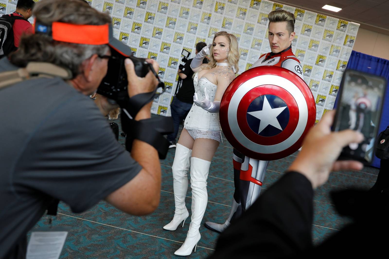 Attendees pose for a picture as they arrive in costumes to enjoy Comic Con International in San Diego