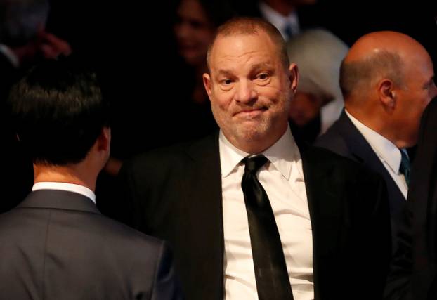 FILE PHOTO: Producer Weinstein stands in the audience ahead of the first presidential debate between U.S. presidential nominee Donald trump and U.S. presidential nominee Clinton in Hempstead