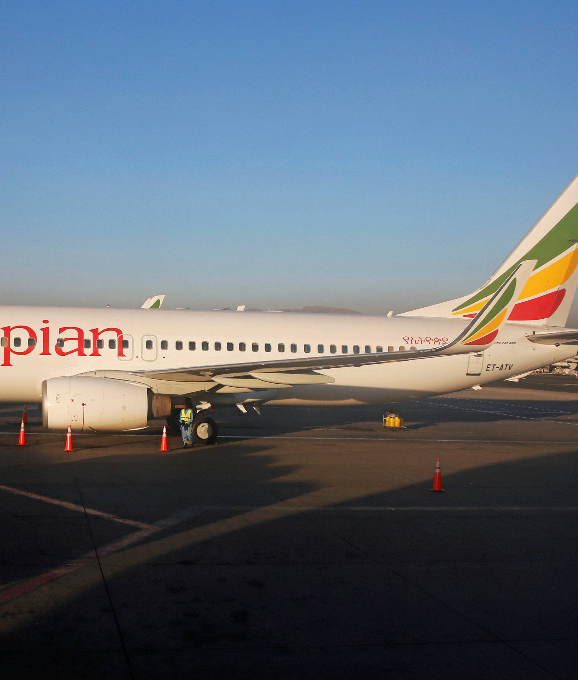 FILE PHOTO: Workers service an Ethiopian Airlines Boeing 737 plane at the Bole International Airport in Ethiopia's capital Addis Ababa