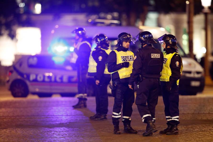Police secure the Champs Elysees Avenue after one policeman was killed and another wounded in a shooting incident in Paris