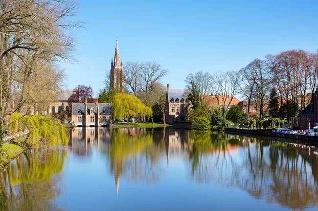 Spring morning in Bruges, Belgium, Lake of Love, Minnewater, medieval houses 
