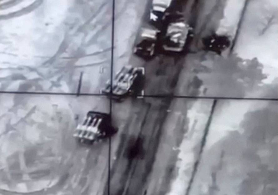 A view of what are said to be Russian Buk missile system vehicles on a road before a drone strike near Malyn