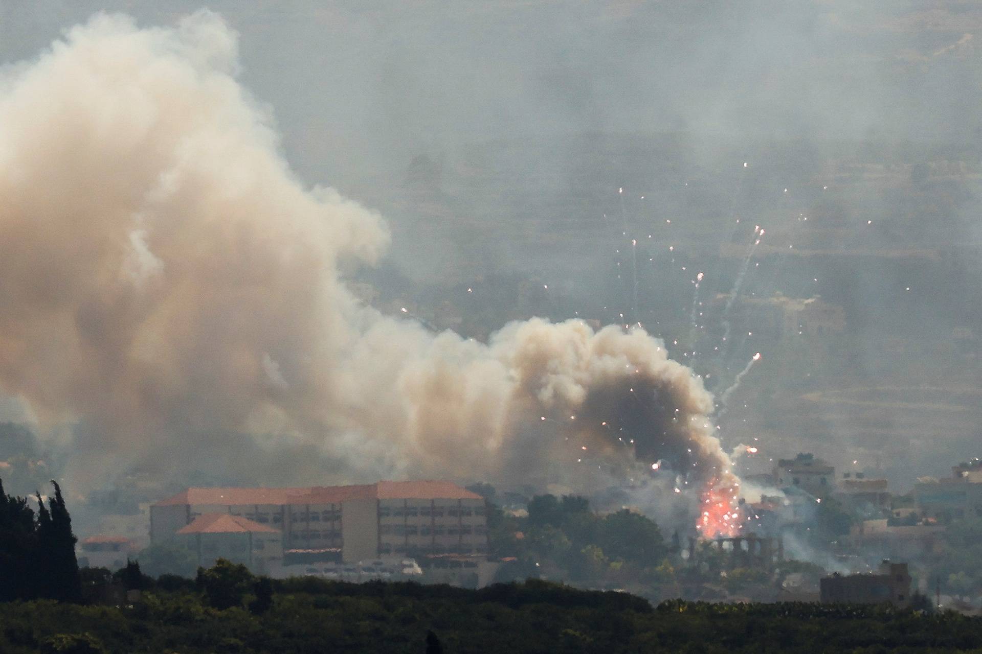 Smoke billows over southern Lebanon following Israeli strikes, as seen from Tyre, southern Lebanon