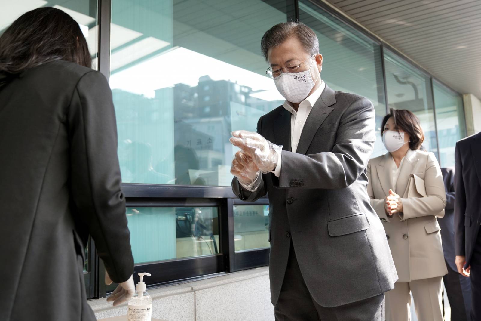 South Korean President Moon Jae-in casts his absentee ballot at a polling station for parliamentary election in Seoul