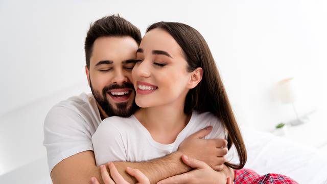 Photo of two people spouses have strong bonding feelings cuddle in house indoors