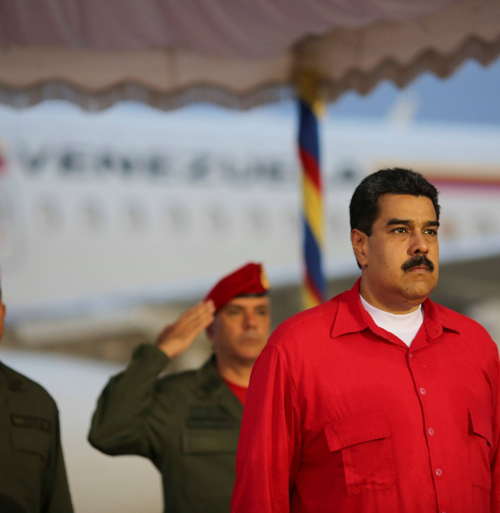 Venezuela's President Nicolas Maduro receives military honors at Maiquetia airport, in Caracas