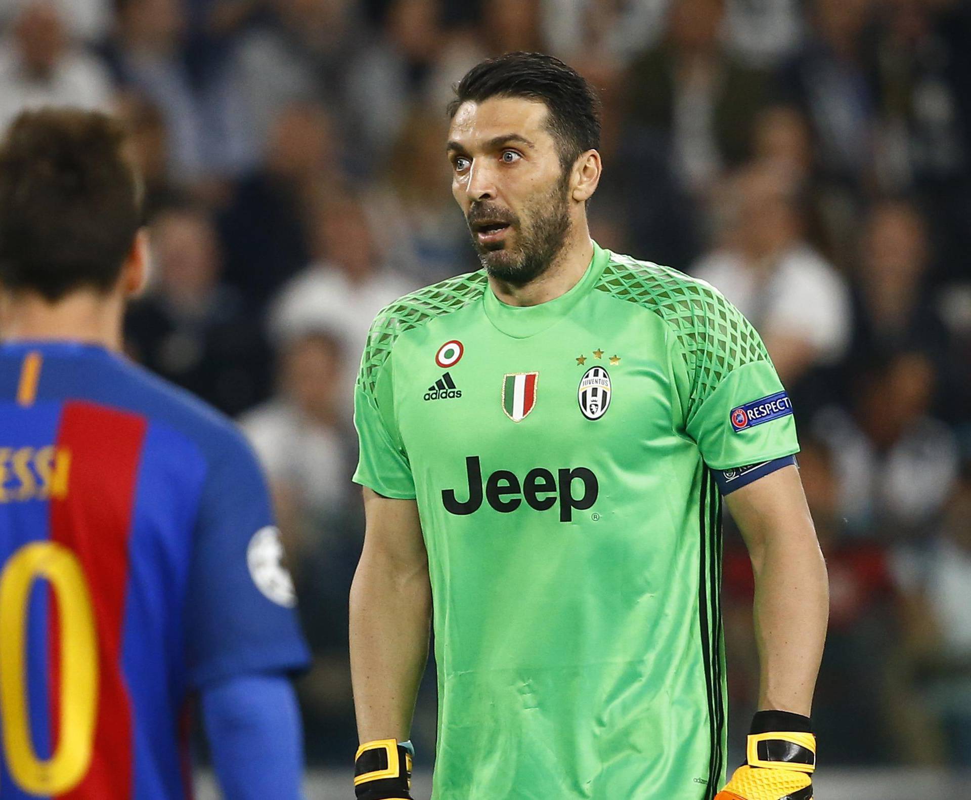 Juventus' Gianluigi Buffon looks on after Barcelona's Lionel Messi has a goal disallowed