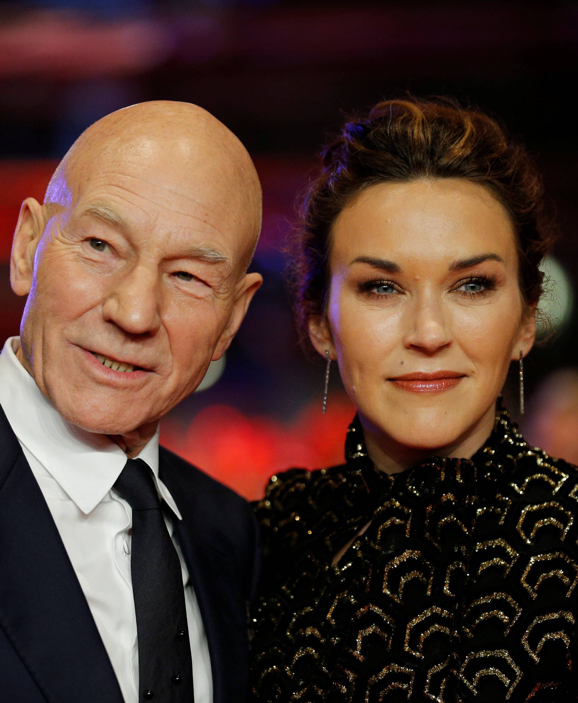 Actor Patrick Stewart and his wife Sunny Ozel arrive for the screening of the movie 'Logan' at the 67th Berlinale International Film Festival in Berlin