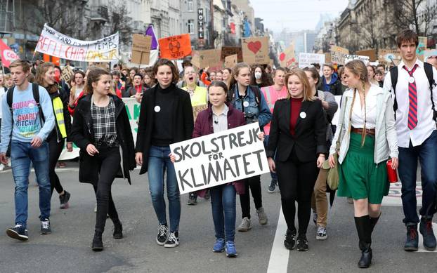 Swedish environmental activist Greta Thunberg and Anuna De Wever, a Belgian climate student activist take part in a protest claiming for urgent measures to combat climate, in central Brussels