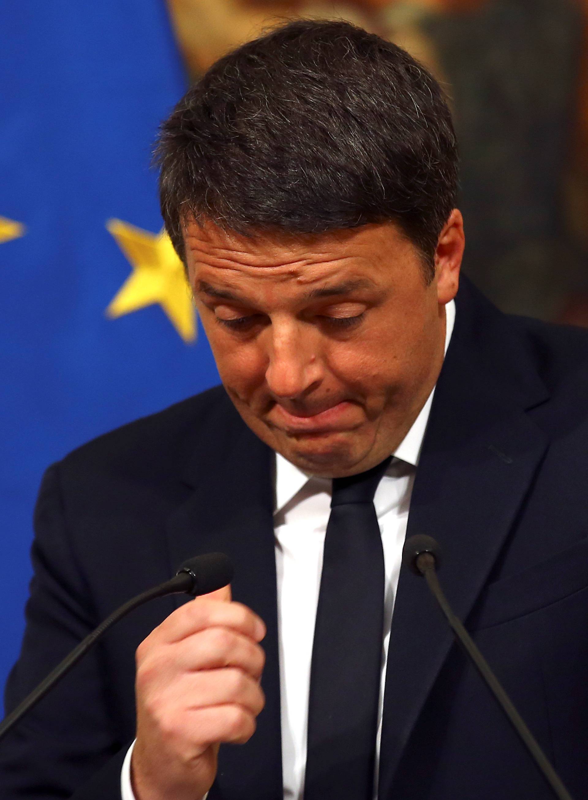 Italian Prime Minister Matteo Renzi gestures during a media conference after a referendum on constitutional reform at Chigi palace in Rome