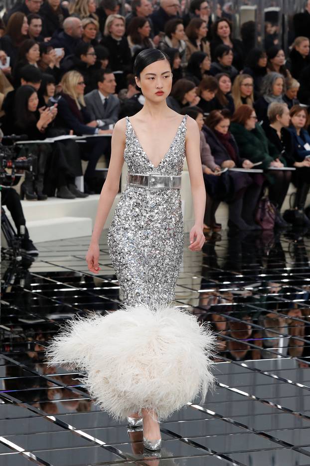 A model presents a creation by German designer Karl Lagerfeld as part of his Haute Couture Spring/Summer 2017 fashion show for Chanel in Paris