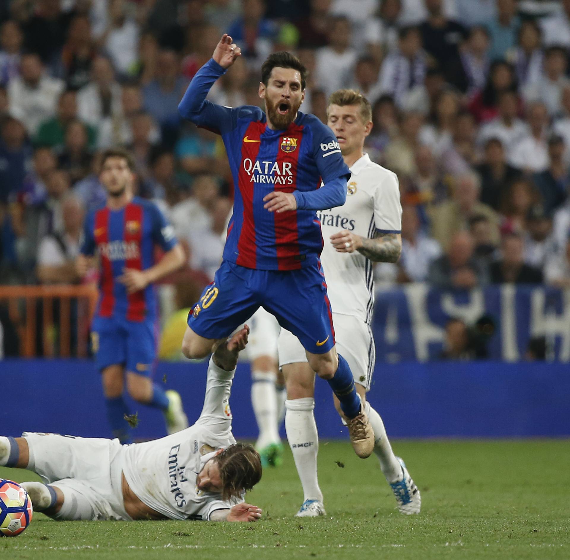 Real Madrid's Sergio Ramos is sent off after this challenge on Barcelona's Lionel Messi
