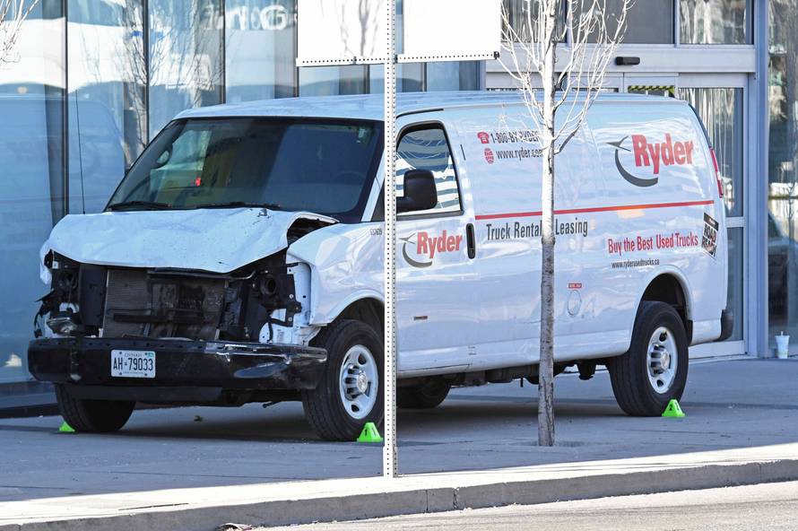 A damaged van seized by police is seen after multiple people were struck at a major intersection northern Toronto