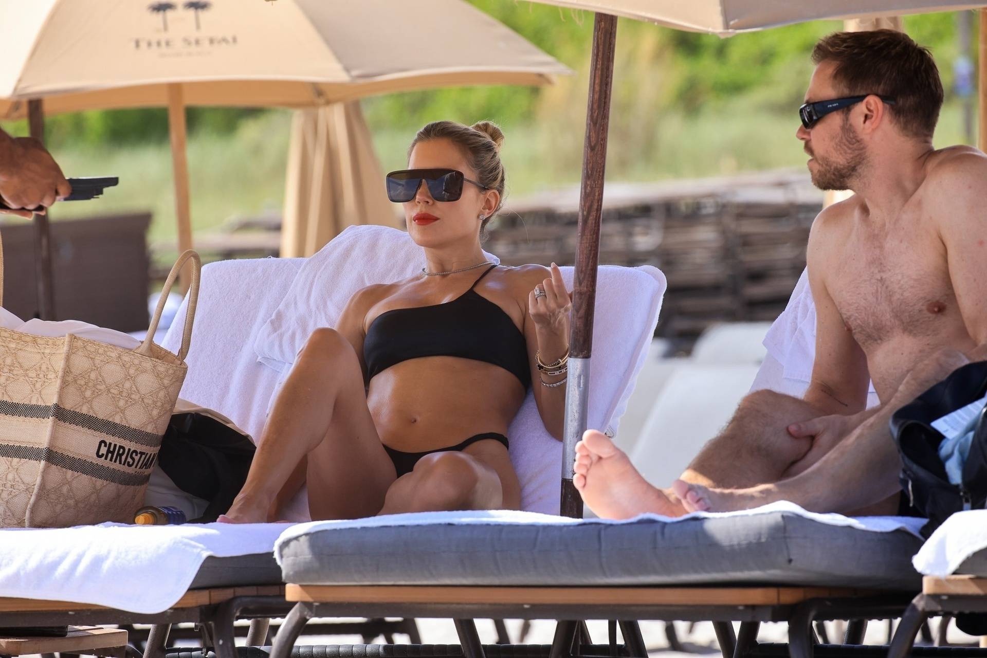 Dutch TV star Sylvie Meis enjoys the Miami sunshine with a friend in a eye-catching black biniki