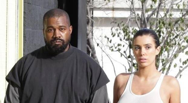 *PREMIUM-EXCLUSIVE* Kanye West sports hotel slippers while Bianca Censori steps out braless in "WET'' t-shirt for tanning session in Melrose Place