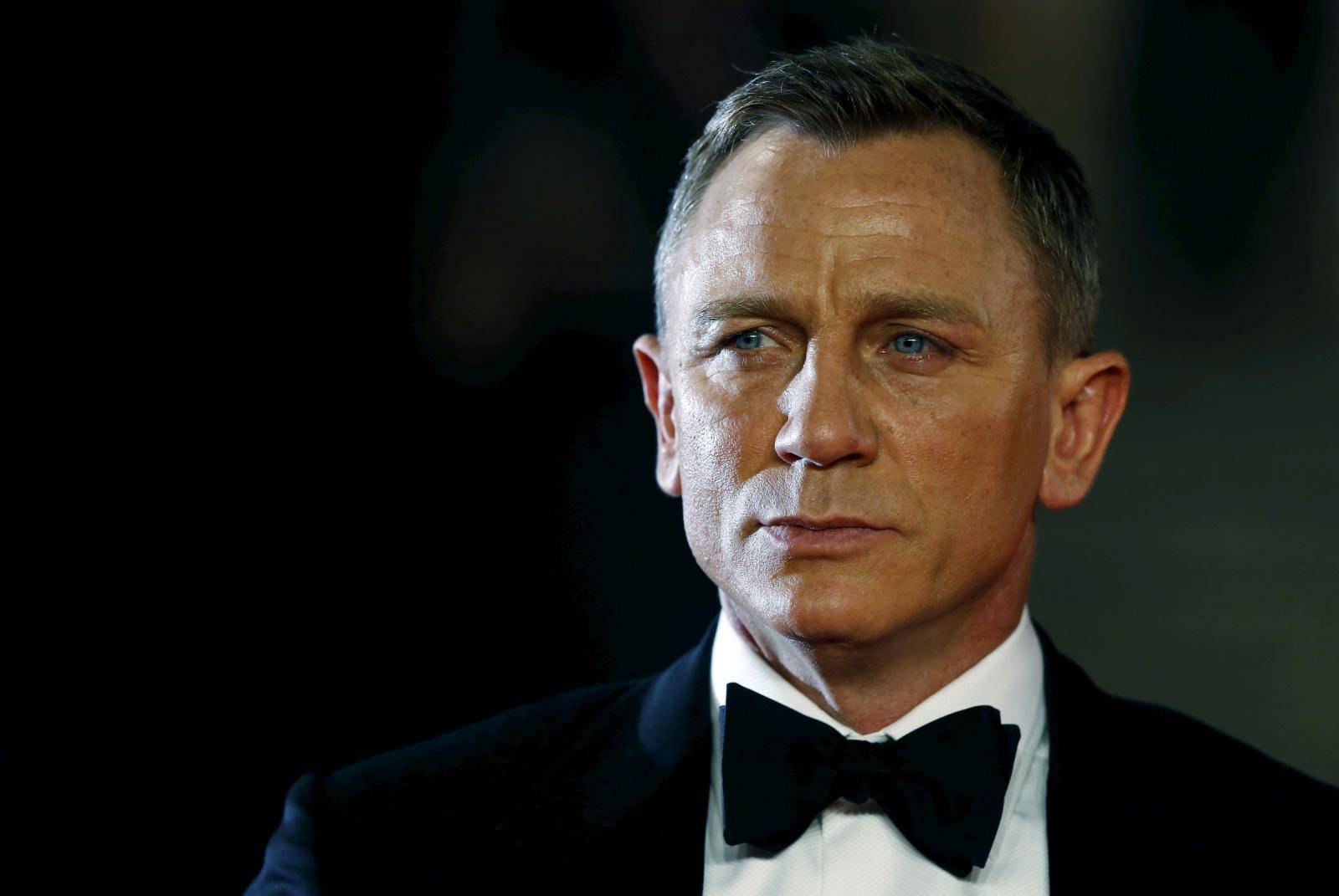FILE PHOTO: Daniel Craig poses for photographers as he attends the world premiere of the new James Bond 007 film "Spectre" at the Royal Albert Hall in London, Britain