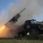 Ukrainian servicemen fire a Grad MLRS towards Russian troops in Donetsk region