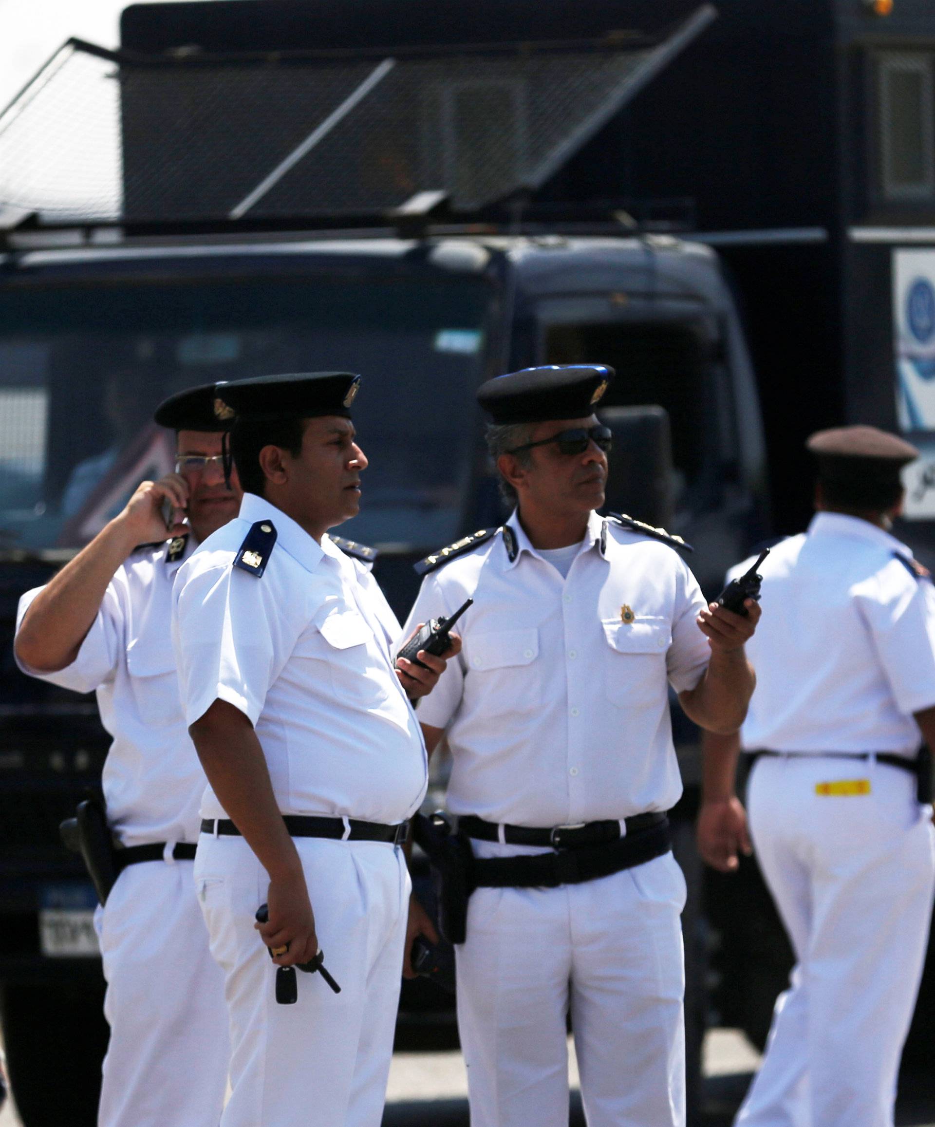 Security personnel are seen outside an Egyptair in-flight service building at Cairo International Airpor