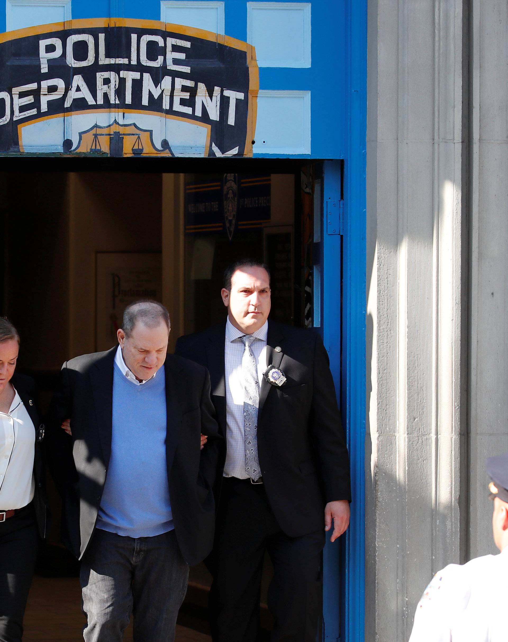 Film producer Harvey Weinstein leaves the 1st Precinct in Manhattan in New York