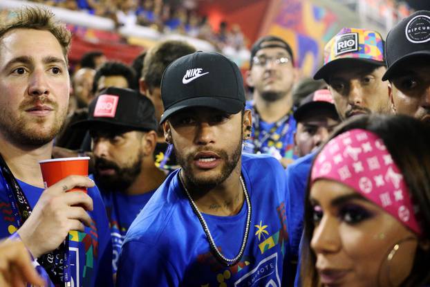 Brazilian soccer player Neymar attends during the second night of the Carnival parade at the Sambadrome in Rio de Janeiro