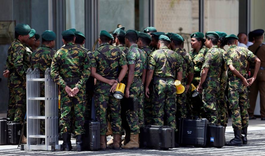 Special Task Force members prepare to go to the site of an explosion at Shangri-La hotel in Colombo