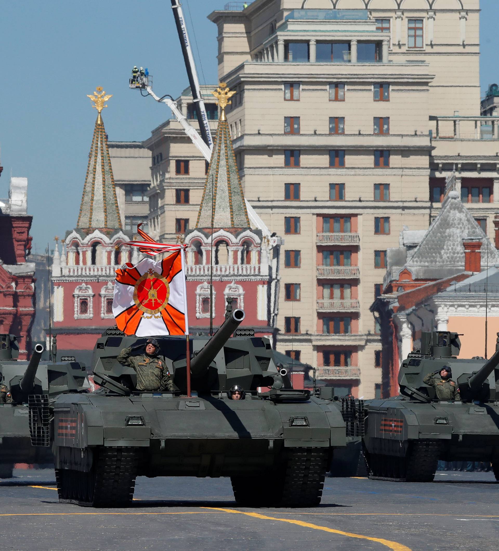 Russian servicemen drive tanks during the Victory Day parade at the Red Square in Moscow