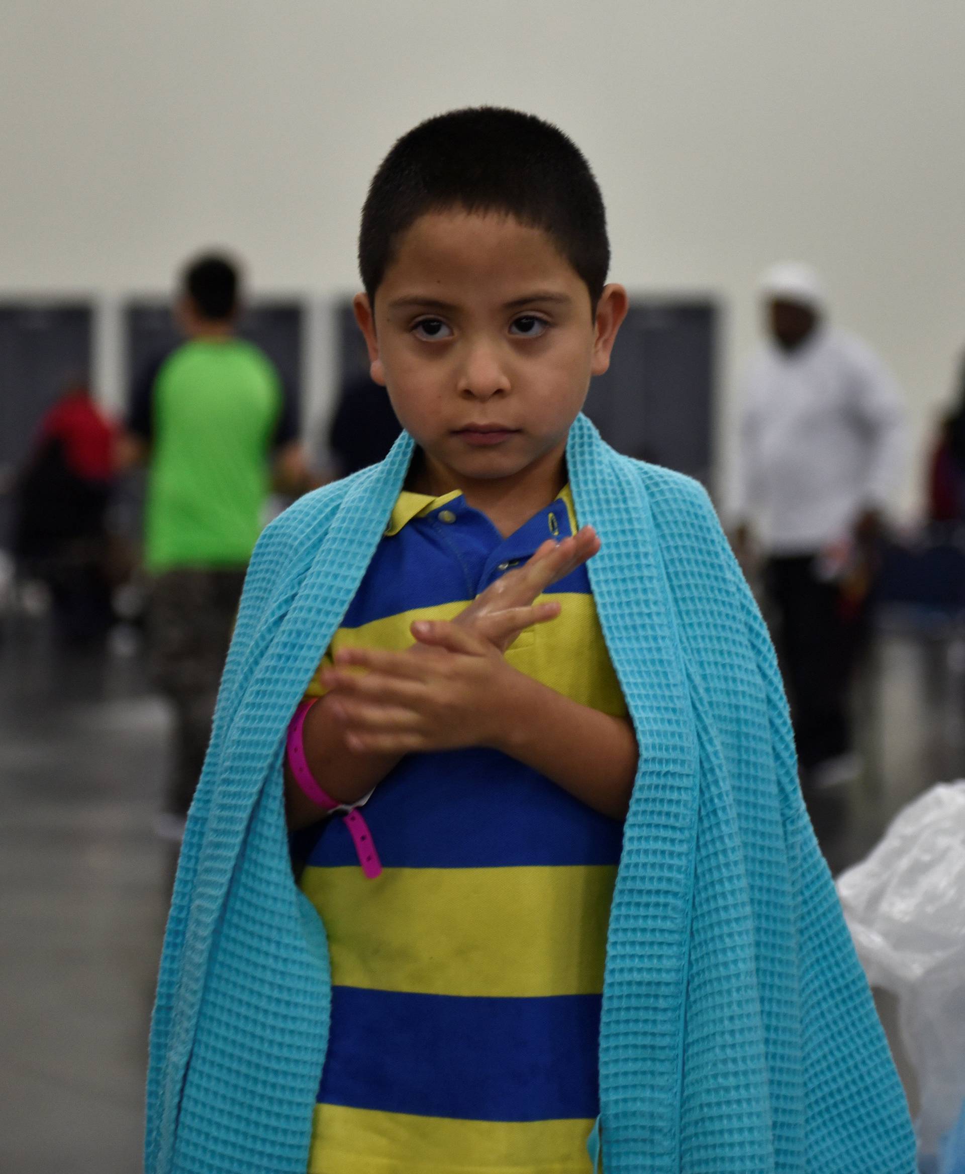 Evacuee Pete Quintana Jr. is wrapped in a blanket at the George R. Brown Convention Center after Hurricane Harvey inundated the Texas Gulf coast with rain causing widespread flooding, in Houston