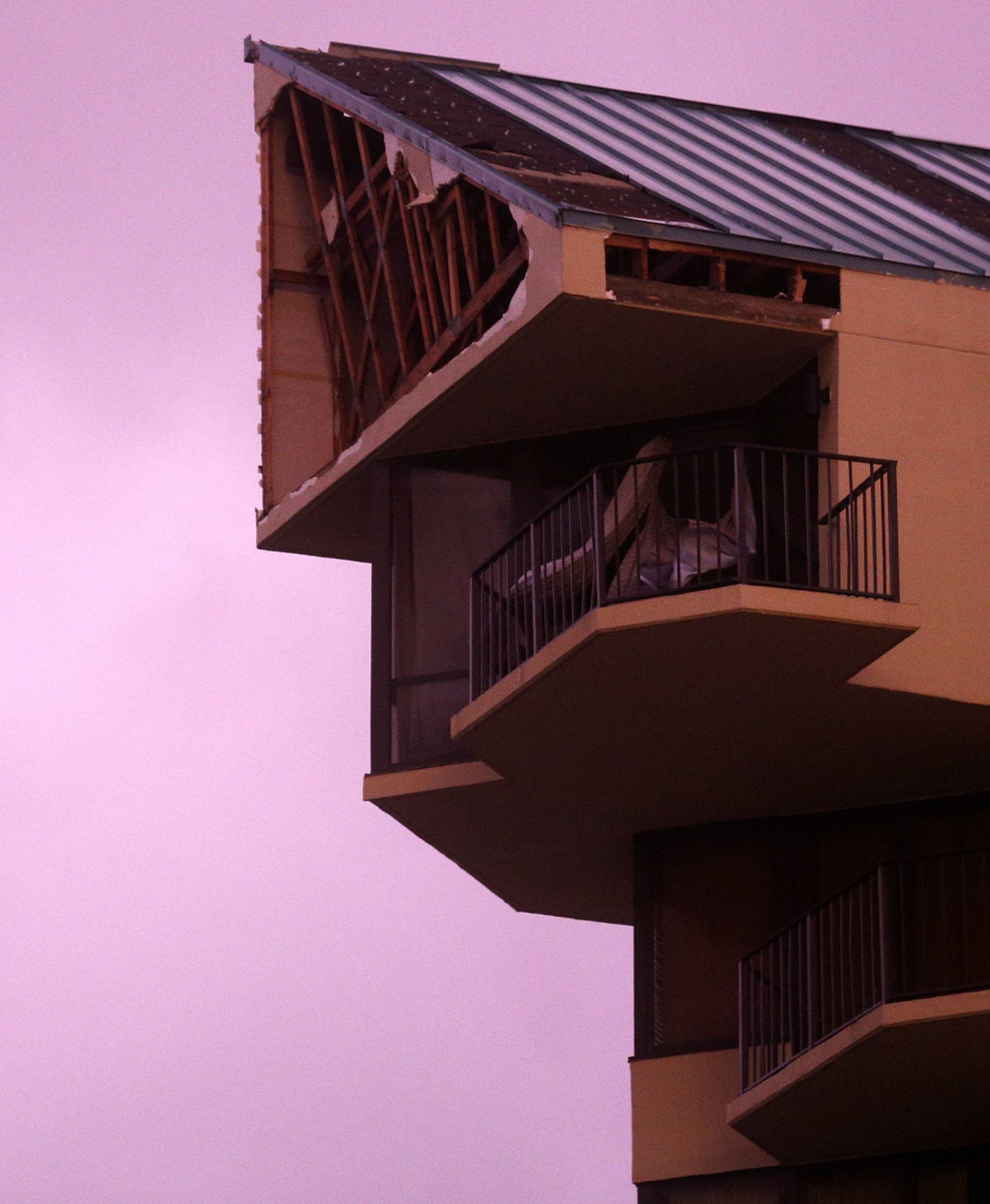 The top section of a high-rise apartment damaged by Hurricane Michael is pictured in Panama City Beach, Florida,