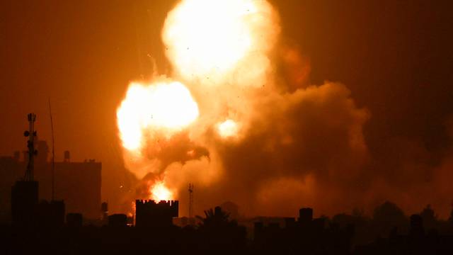 Flames and smoke rise during Israeli air strikes amid a flare-up of Israel-Palestinian violence, in the southern Gaza Strip