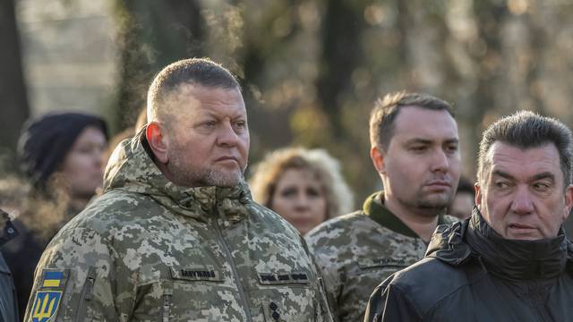 Ukrainian military top commanders visit a monument to Holodomor victims in Kyiv