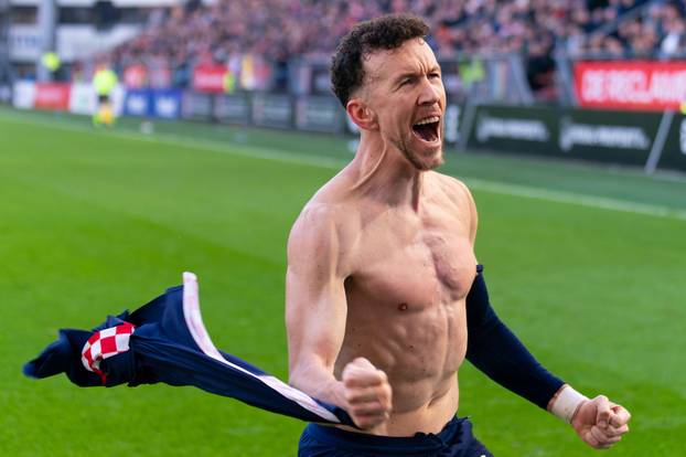 Utrecht, Netherlands. 21st Dec, 2025. UTRECHT, NETHERLANDS - DECEMBER 21: Ivan Perisic of PSV celebrates after scoring the team's second goal during the Dutch Eredivisie match between FC Utrecht and PSV at Stadion Galgenwaard on December 21, 2025 in Utrec