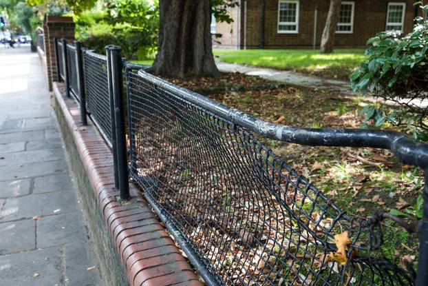 London, UK. 14th August, 2017. A 'stretcher fence' which has fallen into disrepair on the Glebe Estate in Peckham. A campaign has been launched by the Stretcher Railing Society to preserve 'stretcher fences' on south and east London housing estates made f