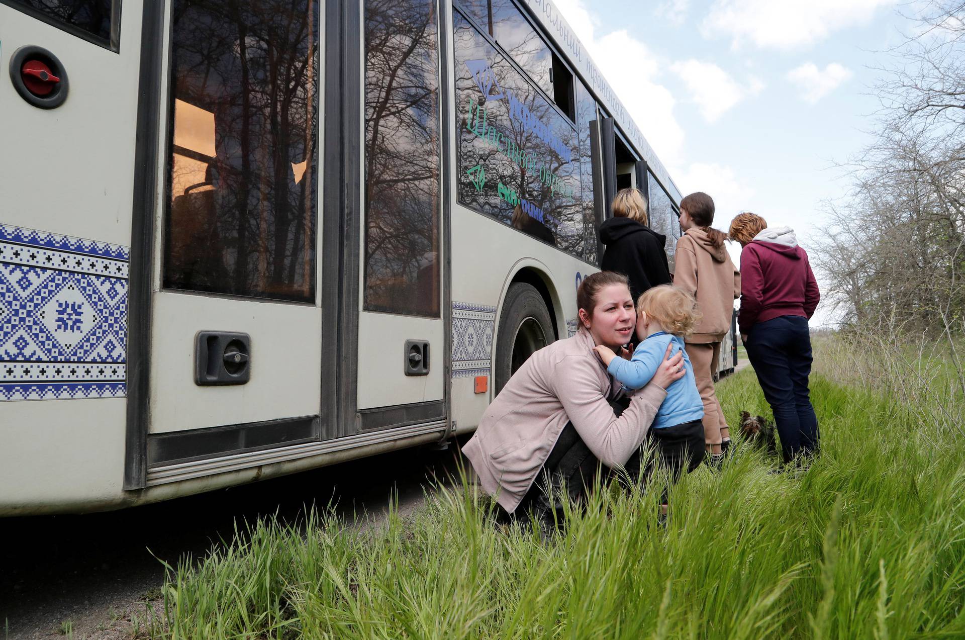 Evacuees from Mariupol travel in a convoy to Zaporizhzhia