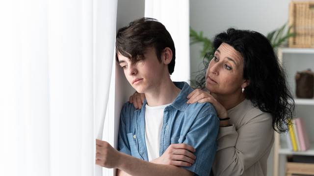 Mother,Comforting,Sad,Teenager,Son.,Depression,In,Adolescence,Concept