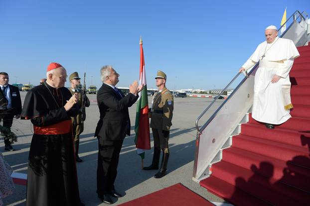 Sept. 12, 2021 : Pope Francis walks down the steps on an airplane as he arrives at Budapest international airport