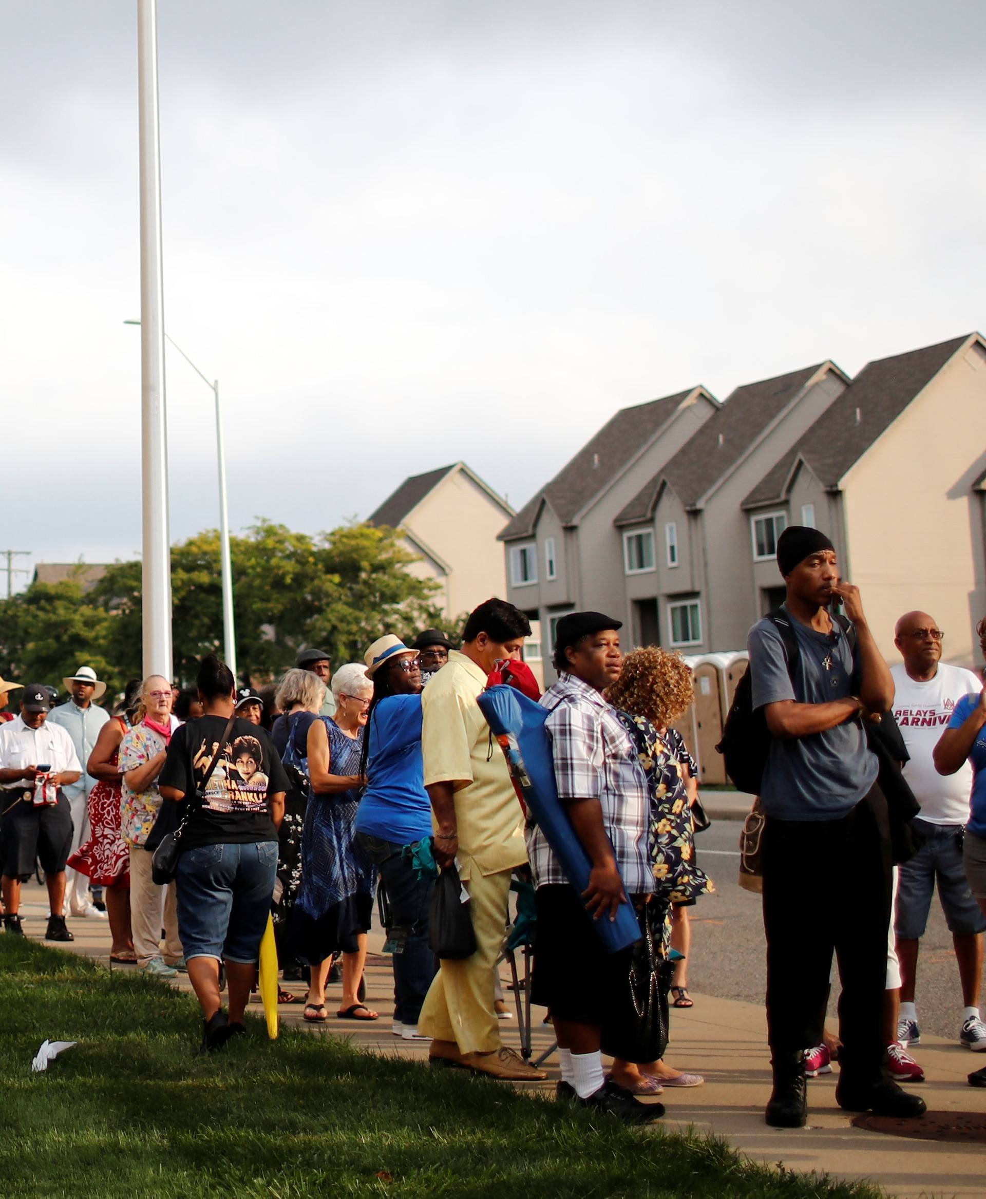 People wait in line outside the Charles H. Wright Museum of African American History for two days of public viewing of Aretha Franklin in Detroit