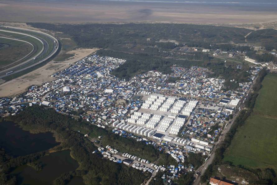 An aerial view shows white containters, tents and makeshift shelters on the eve of the evacuation and dismantlement of the camp called the "Jungle" in Calais