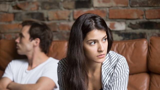 Angry couple avoiding talking after family fight