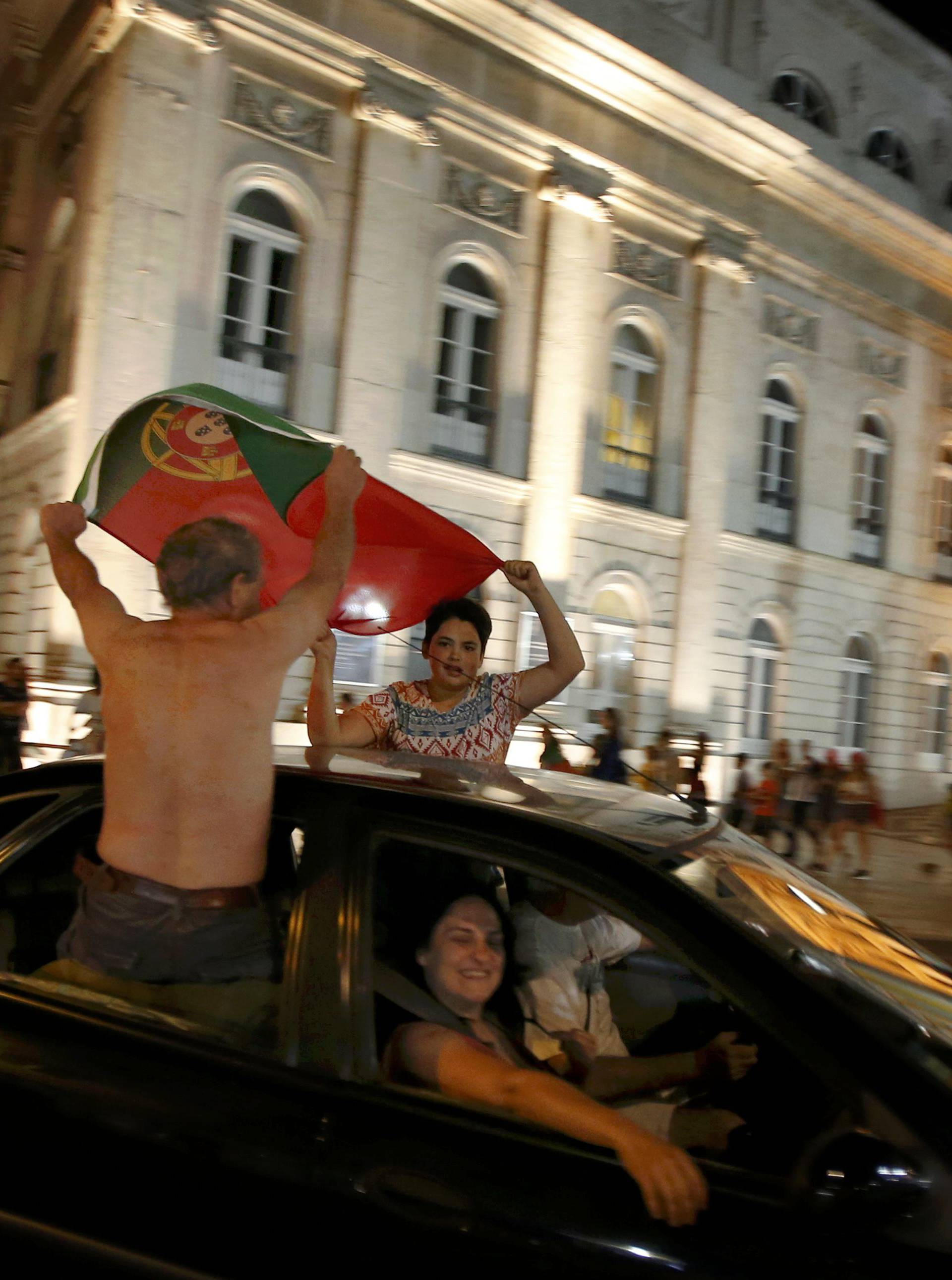 Fans of Portugal celebrate winning the Euro 2016 final between Portugal and France in Lisbon