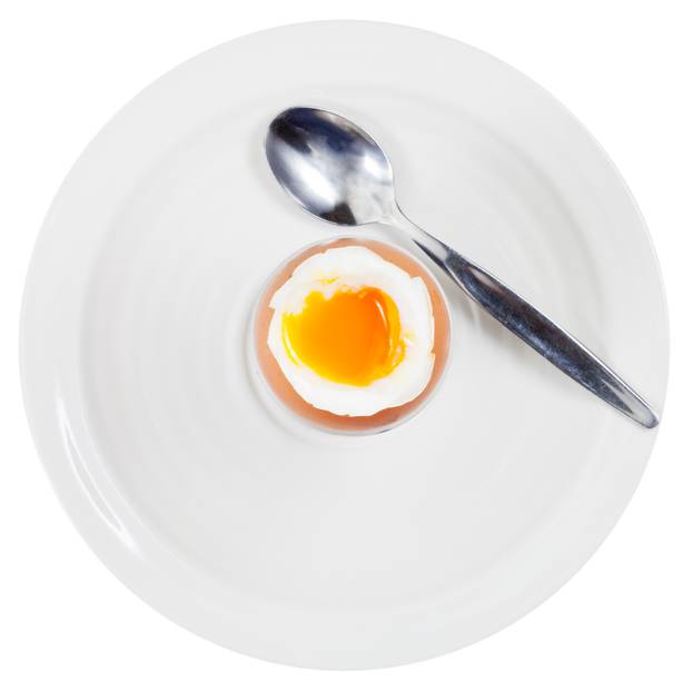 soft boiled egg in cup on white plate
