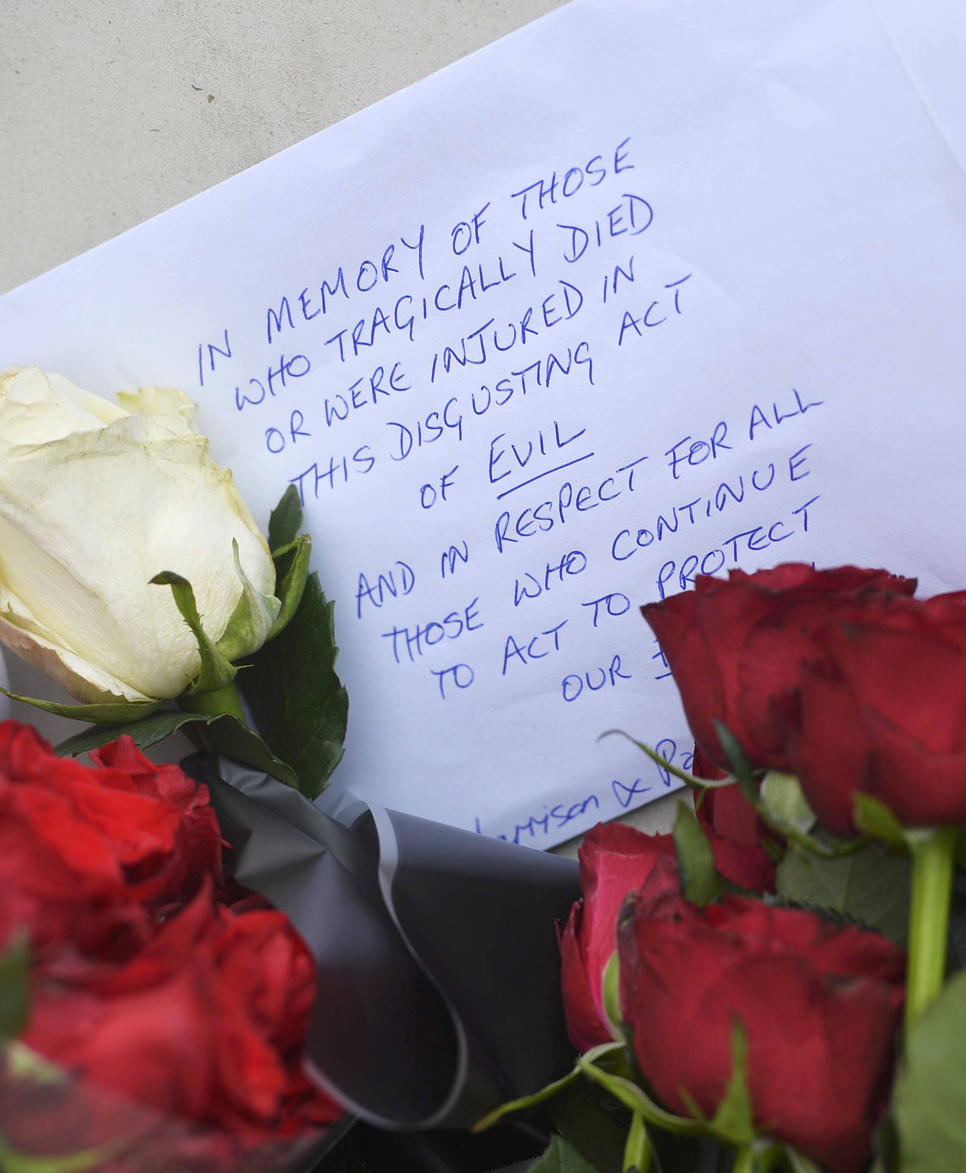 Flowers are left outside New Scotland Yard the morning after an attack in London
