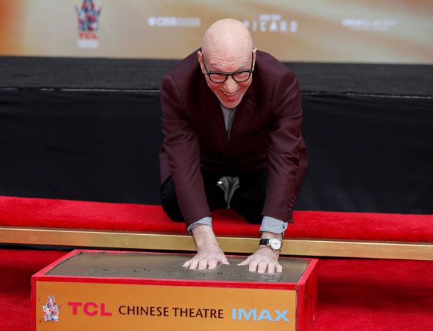 FILE PHOTO: Actor Stewart places his handprints in cement at a ceremony in the forecourt of the TCL Chinese Theatre in Los Angeles