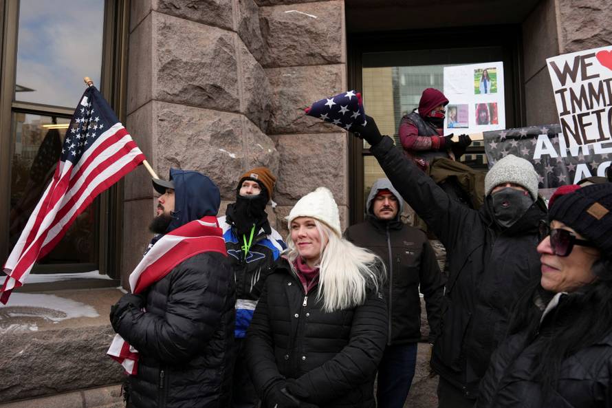 People attend the "March Against Minnesota Fraud" in Minneapolis