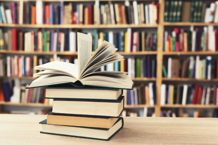 Stack,Of,Books,Against,The,Background,Of,Library,,Stack,Of