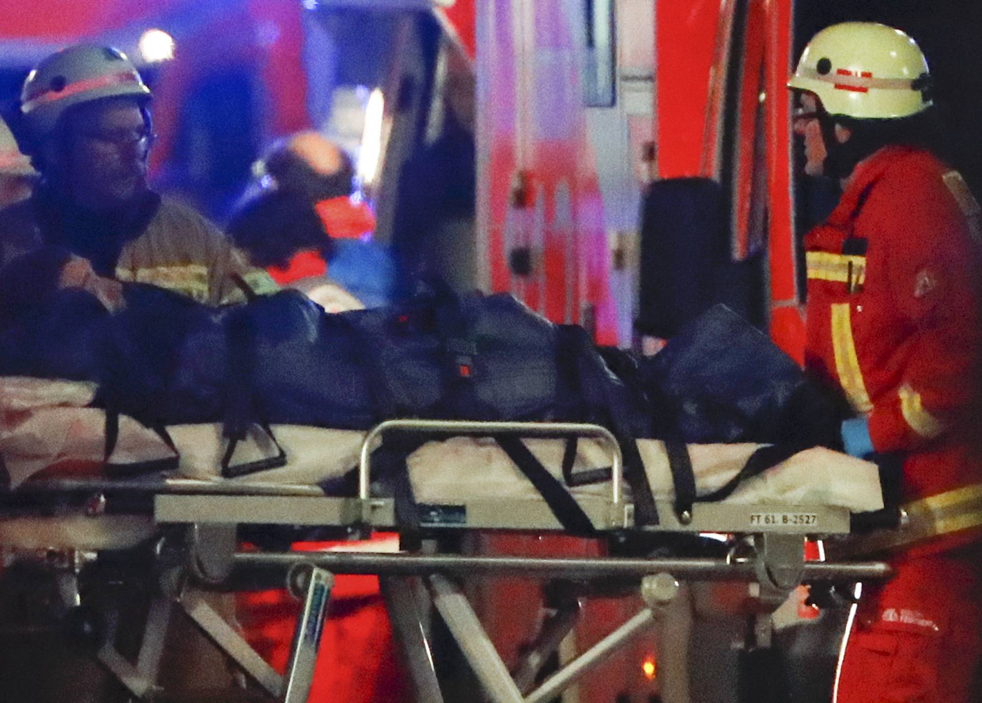 A person is carried into an ambulance near a Christmas market in Berlin