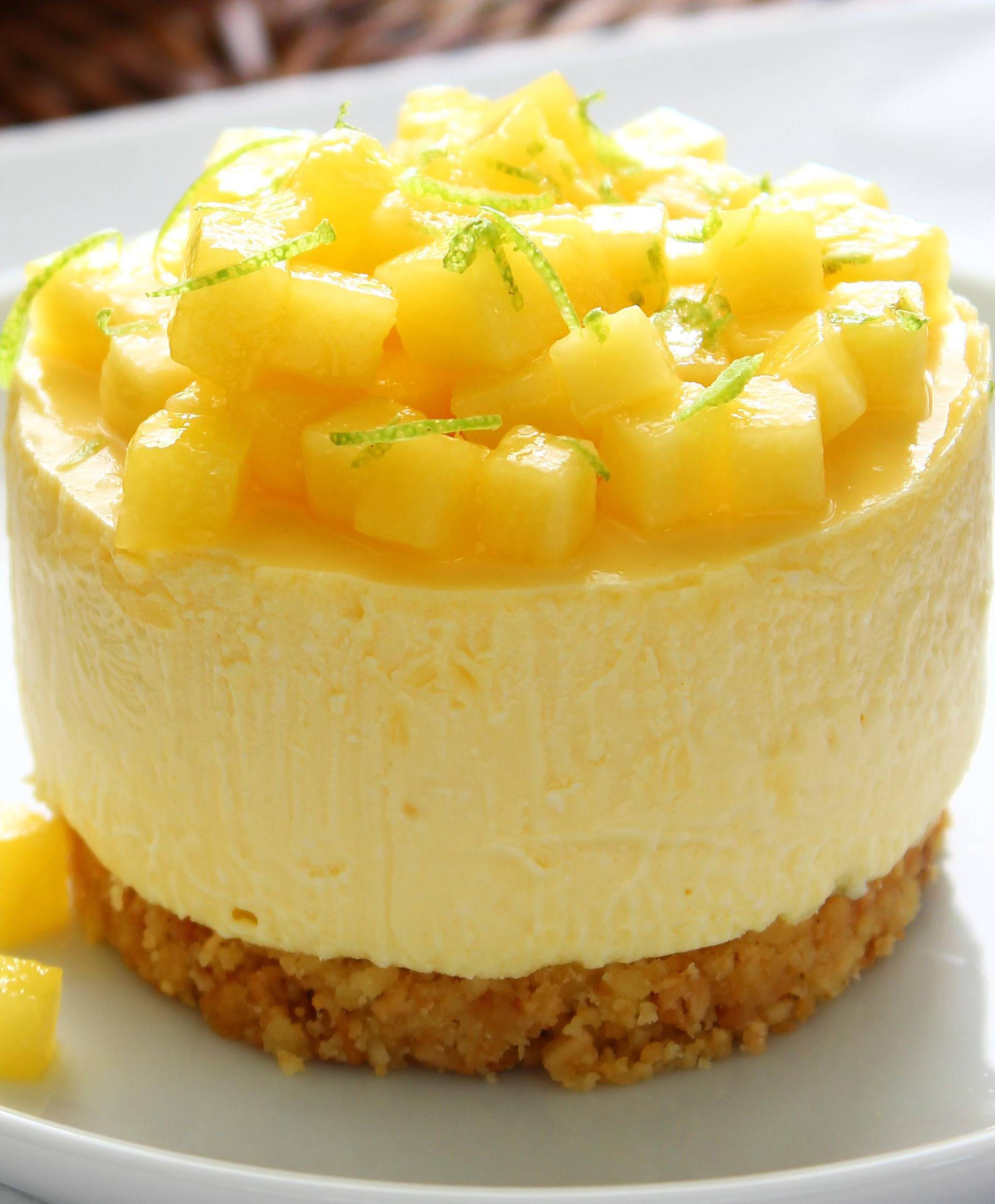 Modern style mango cheese tart on white plate