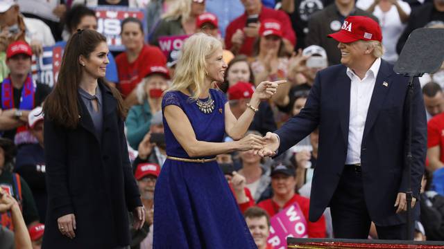 U.S. President-elect Donald Trump greets campaign manager and senior advisor, Kellyanne Conway, and Campaign Communications Director Hope Hicks during a USA Thank You Tour event in Mobile, Alabama