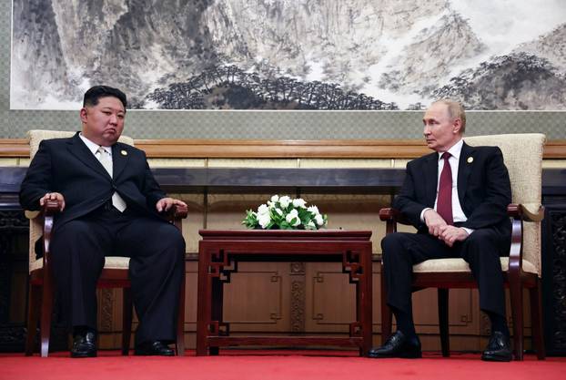 Russian President Vladimir Putin meets with North Korean leader Kim Jong Un in Beijing