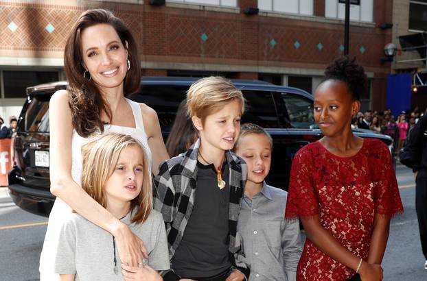 Jolie arrives on the red carpet with her children for the film "The Breadwinner" during the Toronto International Film Festival in Toronto
